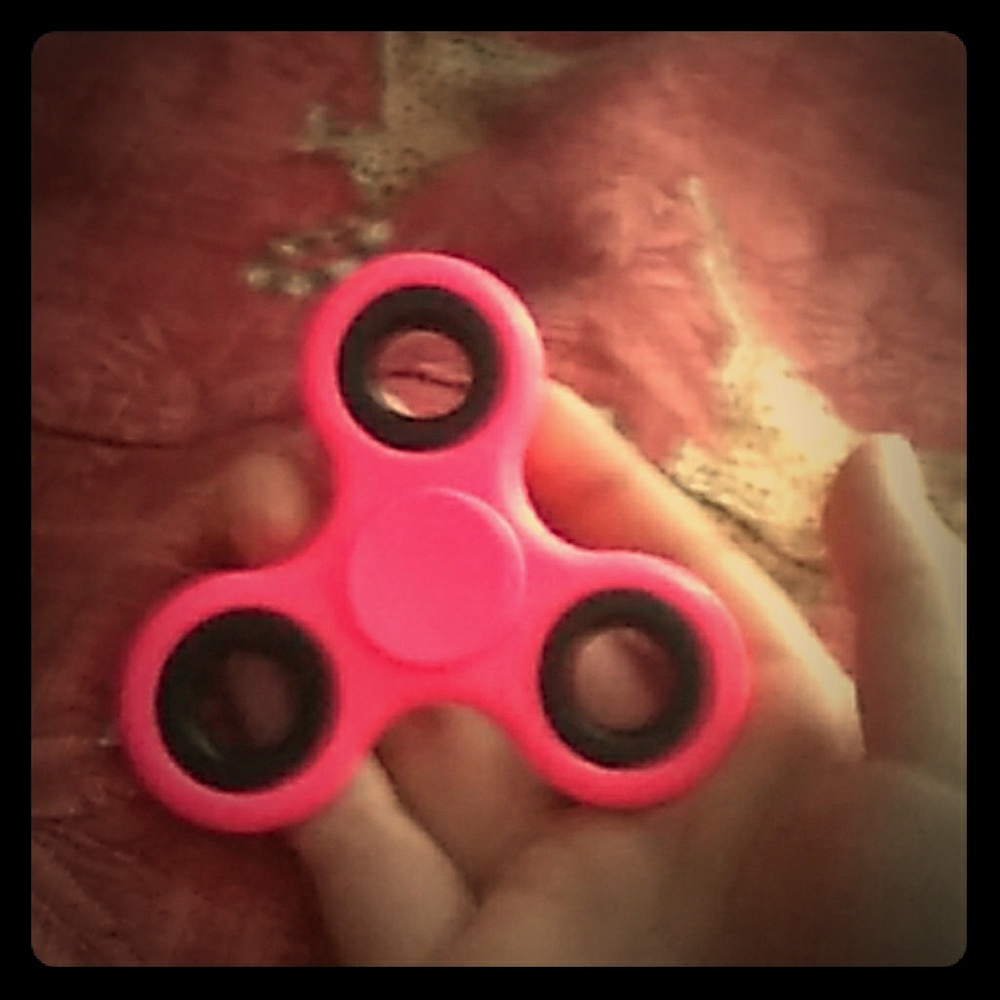 Neon pink fidget spinner